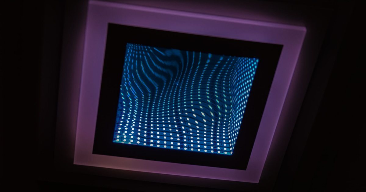 An infinity mirror: a square of lights repeating into a tunnel